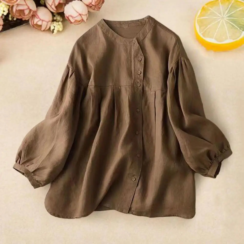 Loose-fitting retro women's blouse with balloon sleeves, stylish and comfortable, by Corporación Turística.