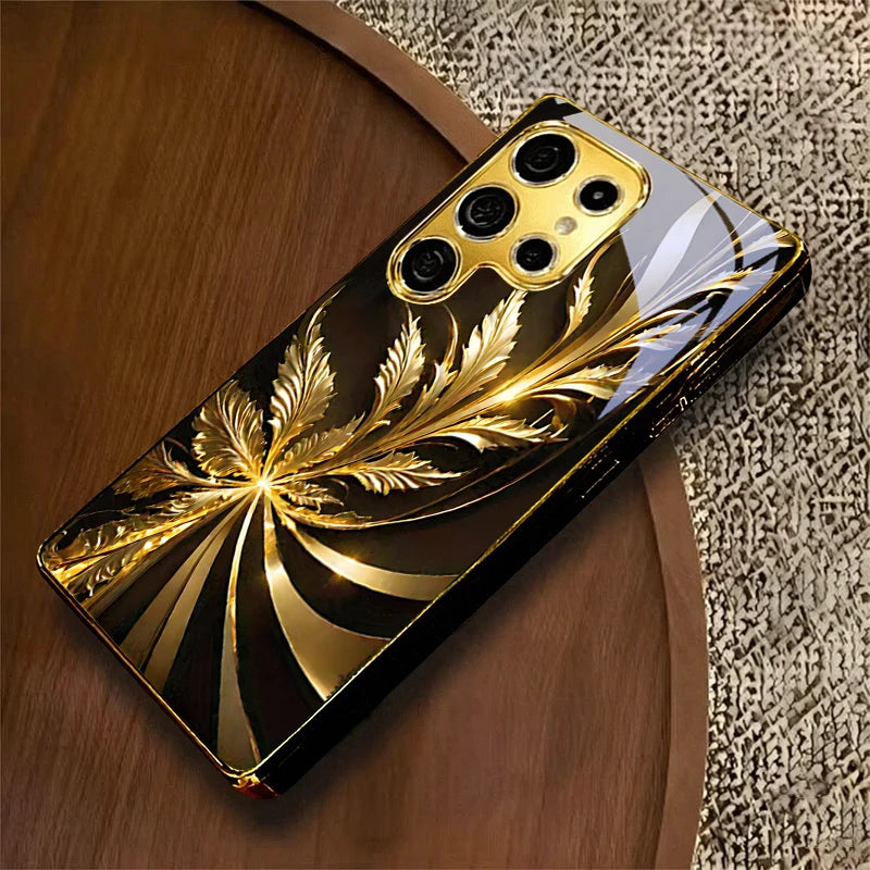 Golden phone case with radiant foliage design, stylish protective cover for smartphones by Corporación Turística.