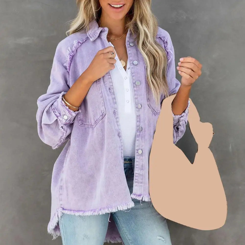 Oversized women's denim jacket by Corporación Turística, casual streetwear style, shown on a model in a city setting.
