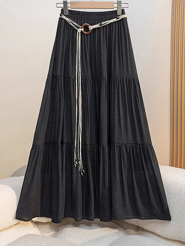 Long boho midi summer skirt made of cotton and linen, featuring flowing fabric and a relaxed, bohemian style.