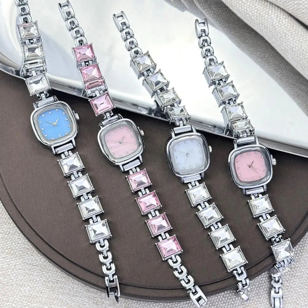 Brillante women's square dial wristwatch by Corporación Turística with a sleek, modern design and polished metal band.