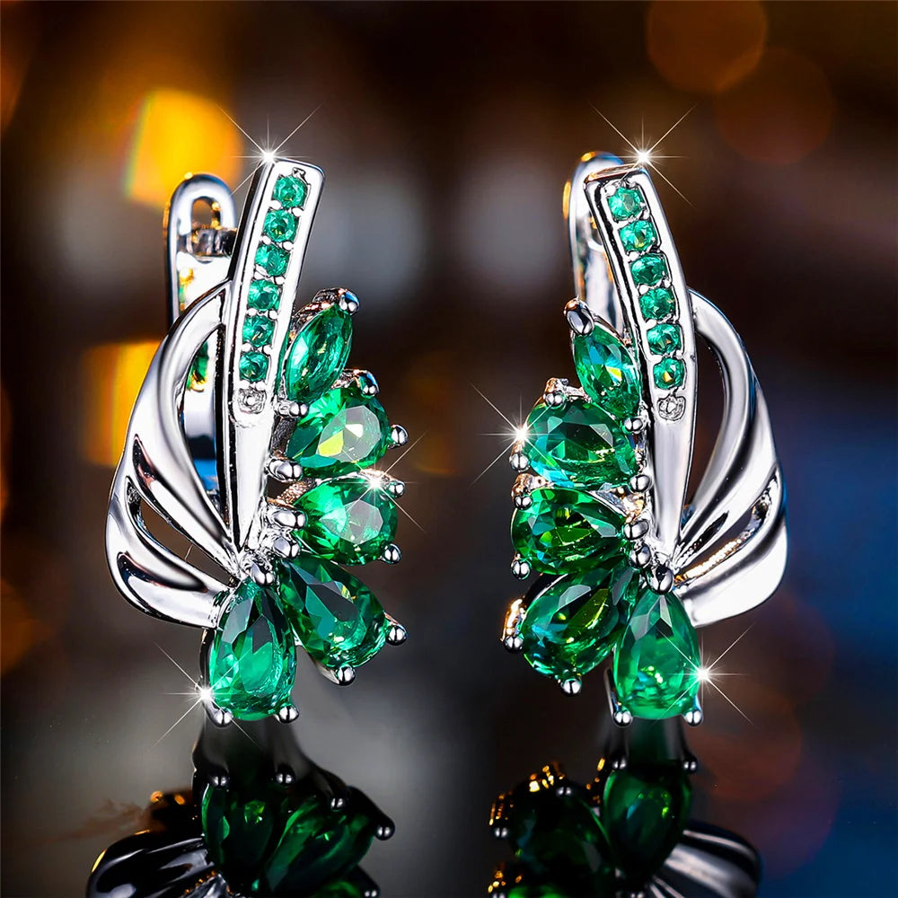 Elegant luxury clip-on earrings in green and blue for women, featuring vibrant gemstones and intricate design.