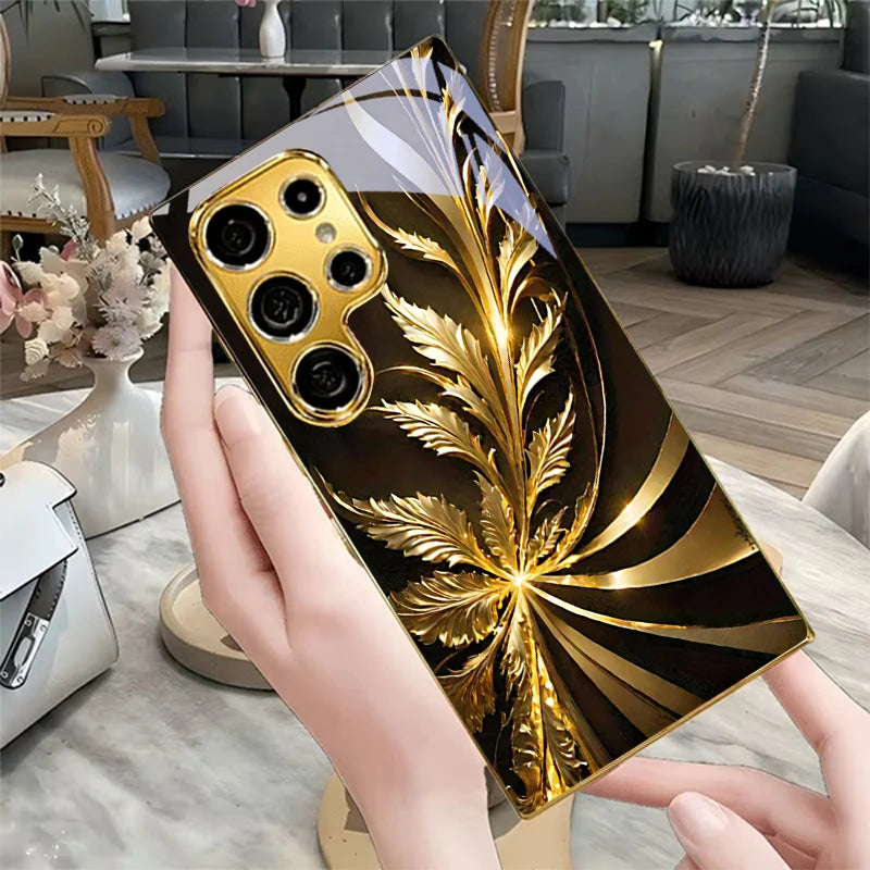 Golden phone case with radiant foliage design, featuring intricate leaf patterns and a stylish protective cover.