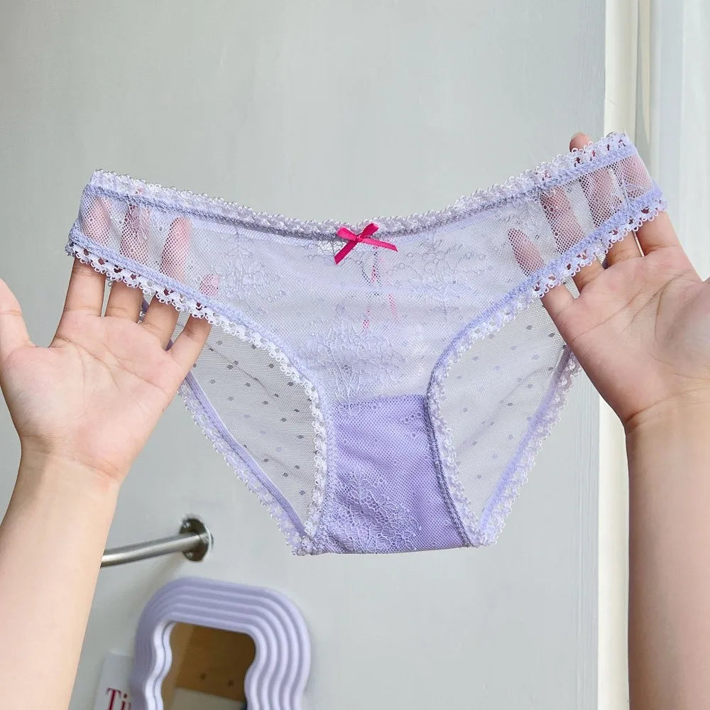 Transparent mesh panties with decorative bow, designed for comfort and style, by Corporación Turística.