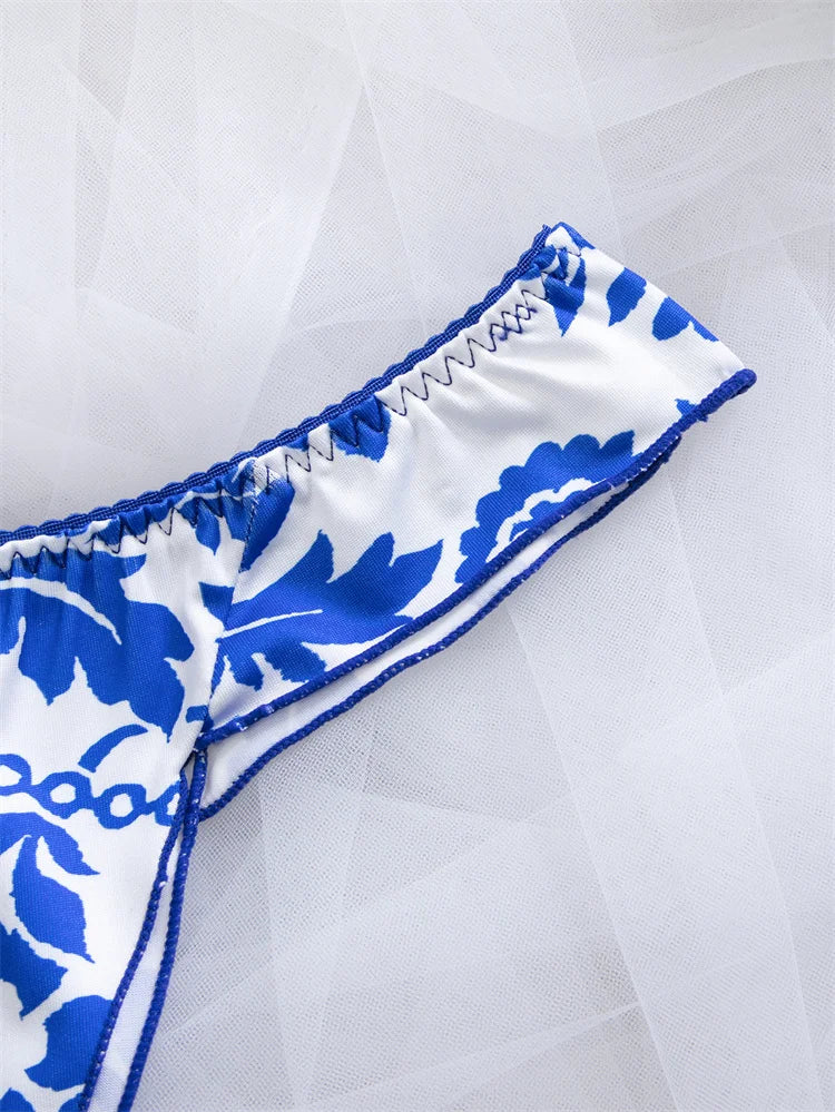 Floral blue women's lingerie set featuring matching bra and panties with vibrant floral print from Corporación Turística.