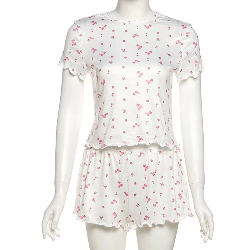 Two-piece autumn floral pajama set for women, featuring a long-sleeve top and matching pants, by Corporación Turística.