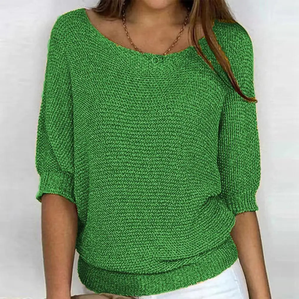 Solid color women's jersey sweater by Corporación Turística, close-up of soft knit fabric and classic neckline.