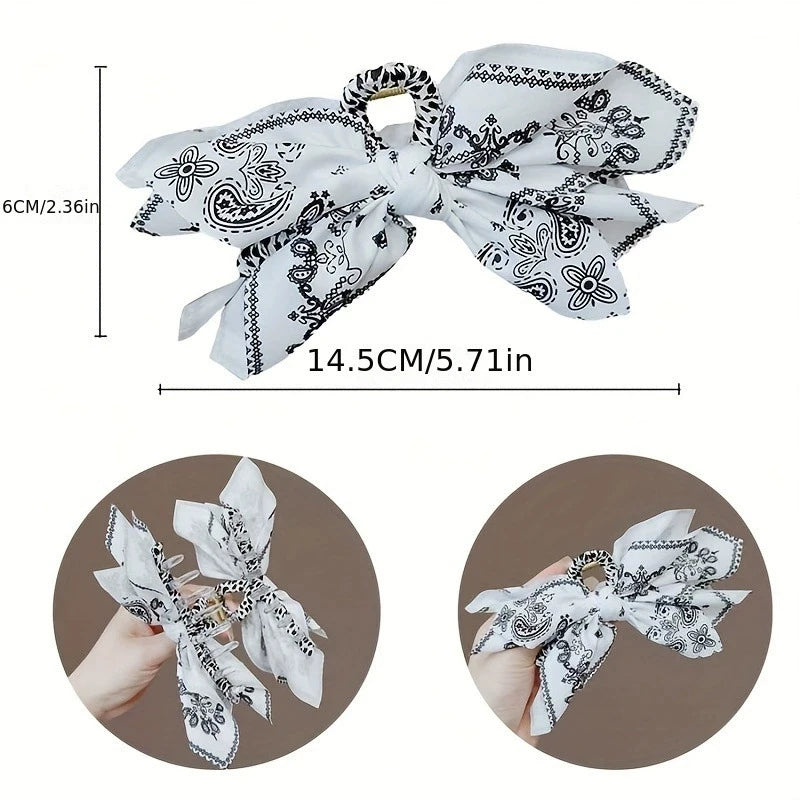 Elegant hair clip with a floral bow design from Corporación Turística, perfect for styling and accessorizing hair.