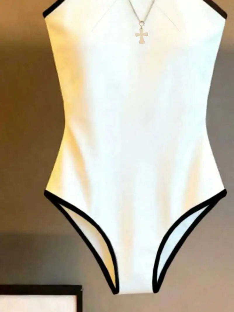 Halter body for women with contrasting trim, designed by Corporación Turística, displayed on a model in a stylish pose.