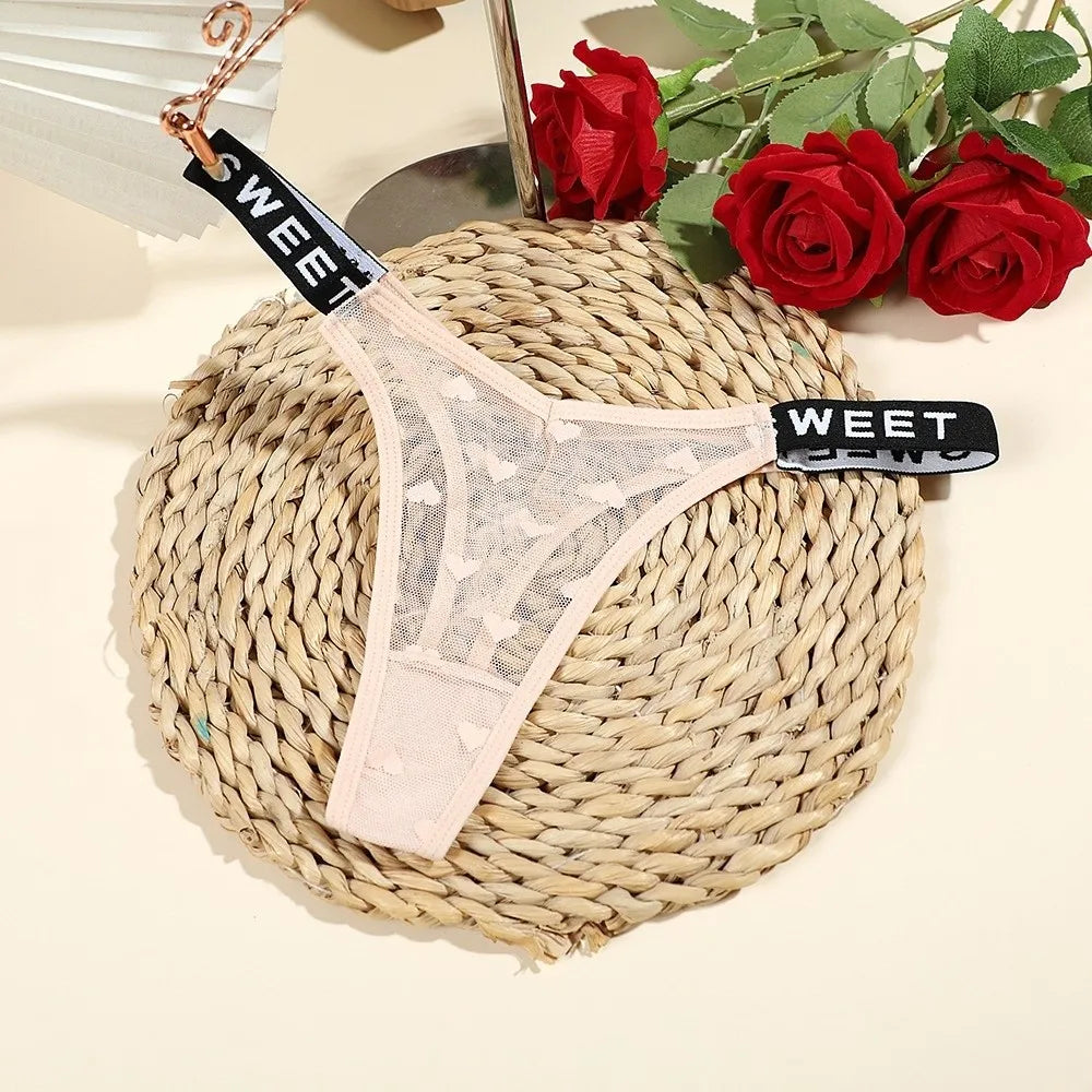 Cotton heart mesh thong from Corporación Turística, seamless design, comfortable women's lingerie, visible lace detail.