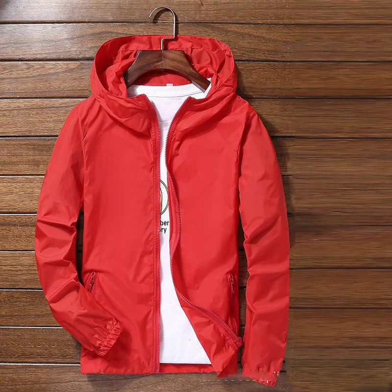 Quick-dry cycling and running raincoat by Corporación Turística, lightweight waterproof protector for outdoor activities.