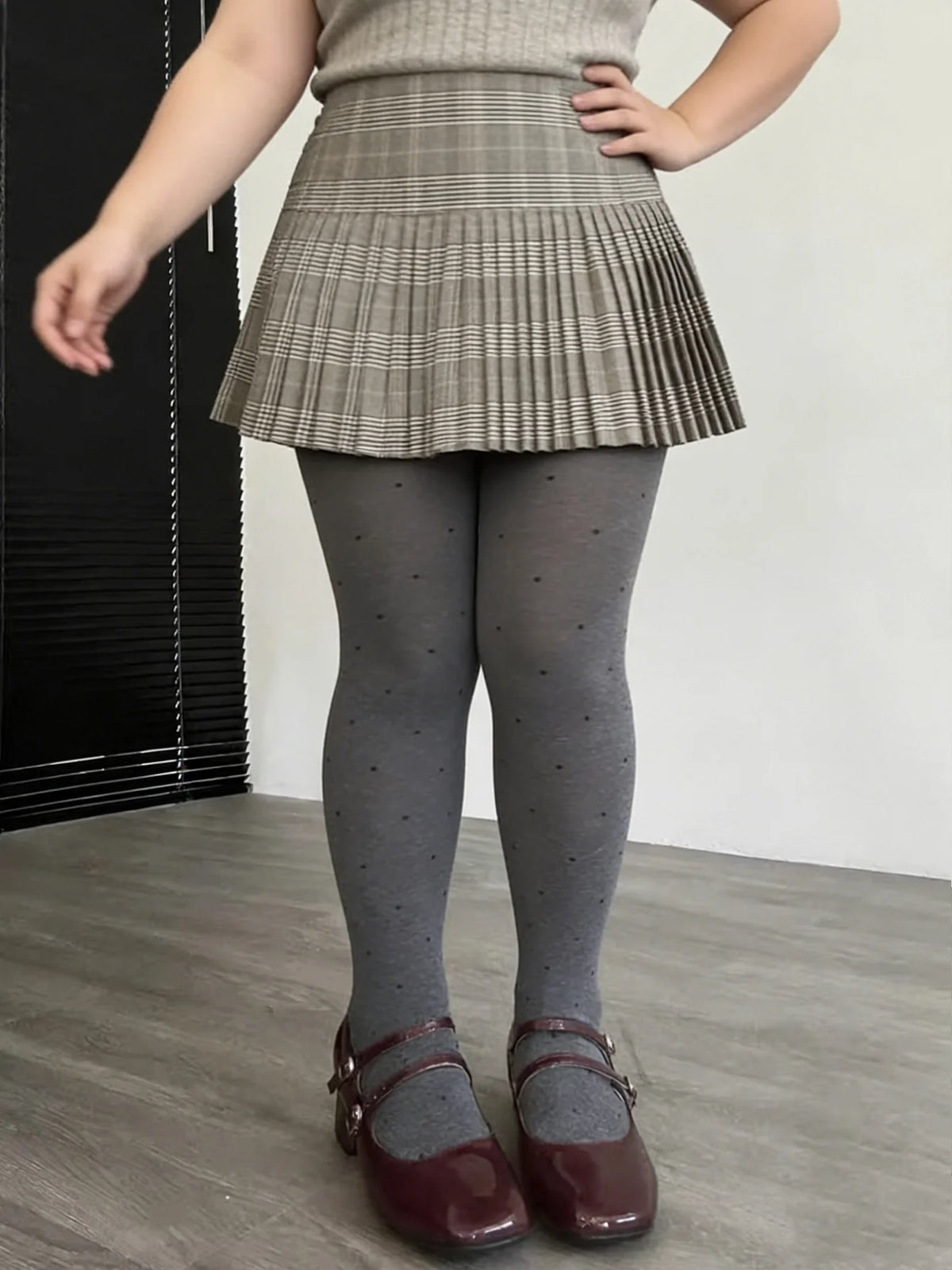 Vintage gray knit tights with small polka dots, perfect for stylish and comfortable everyday wear by Corporación Turística.
