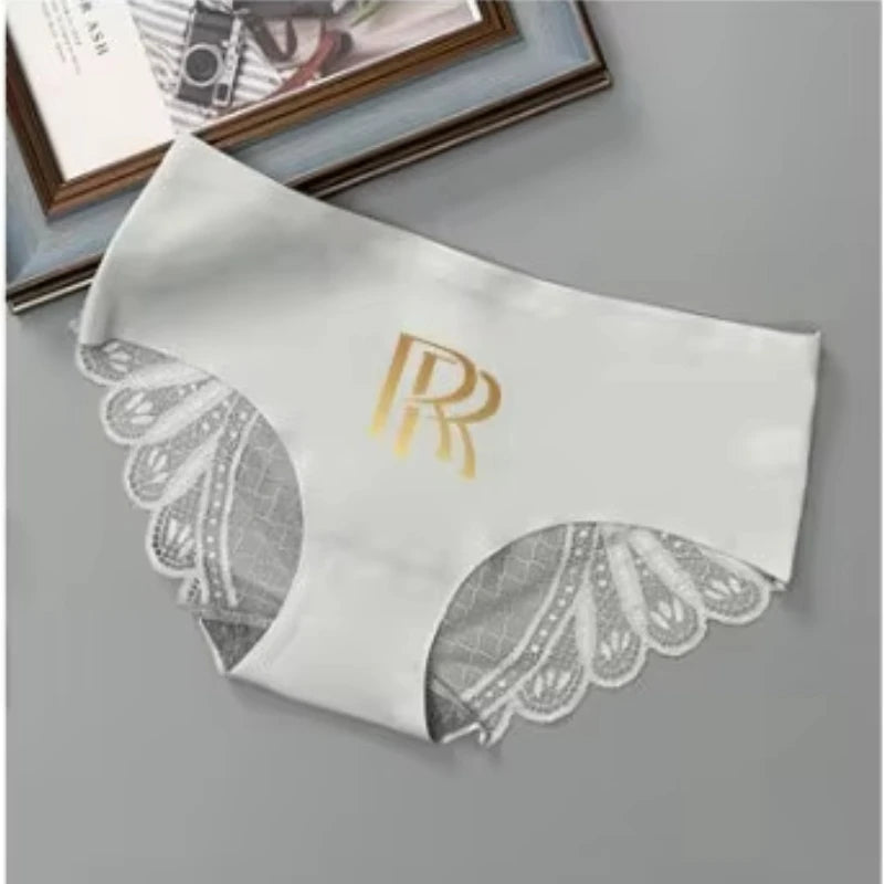 Pair of matching lace couple's underwear, sexy boxer briefs by Corporación Turística, displayed on a flat surface.