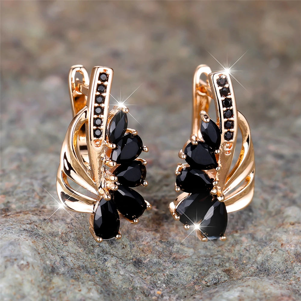 Elegant clip-on earrings in green and blue luxury design for women, featuring vibrant gemstone details.