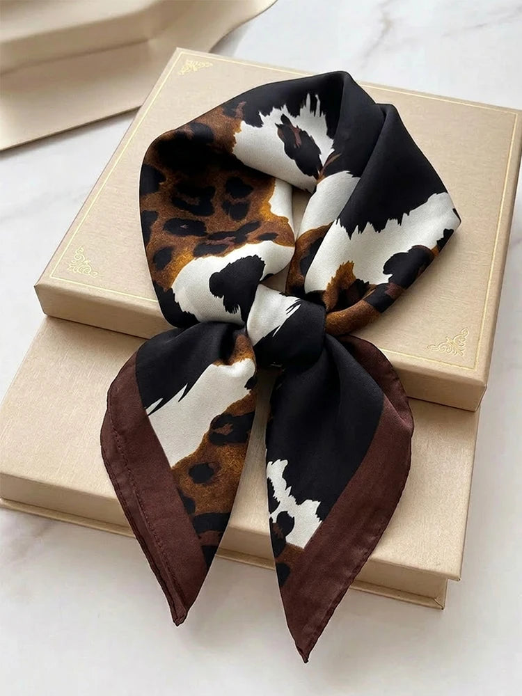 Square imitation silk scarf with pattern, featuring vibrant colors and intricate design, suitable for fashion accessories.