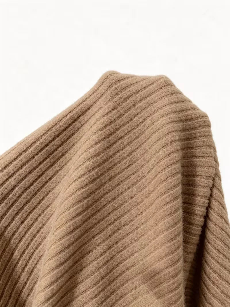 Cream-colored sleeveless ribbed knit body for women from Corporación Turística, showing close-up of fabric texture and design.