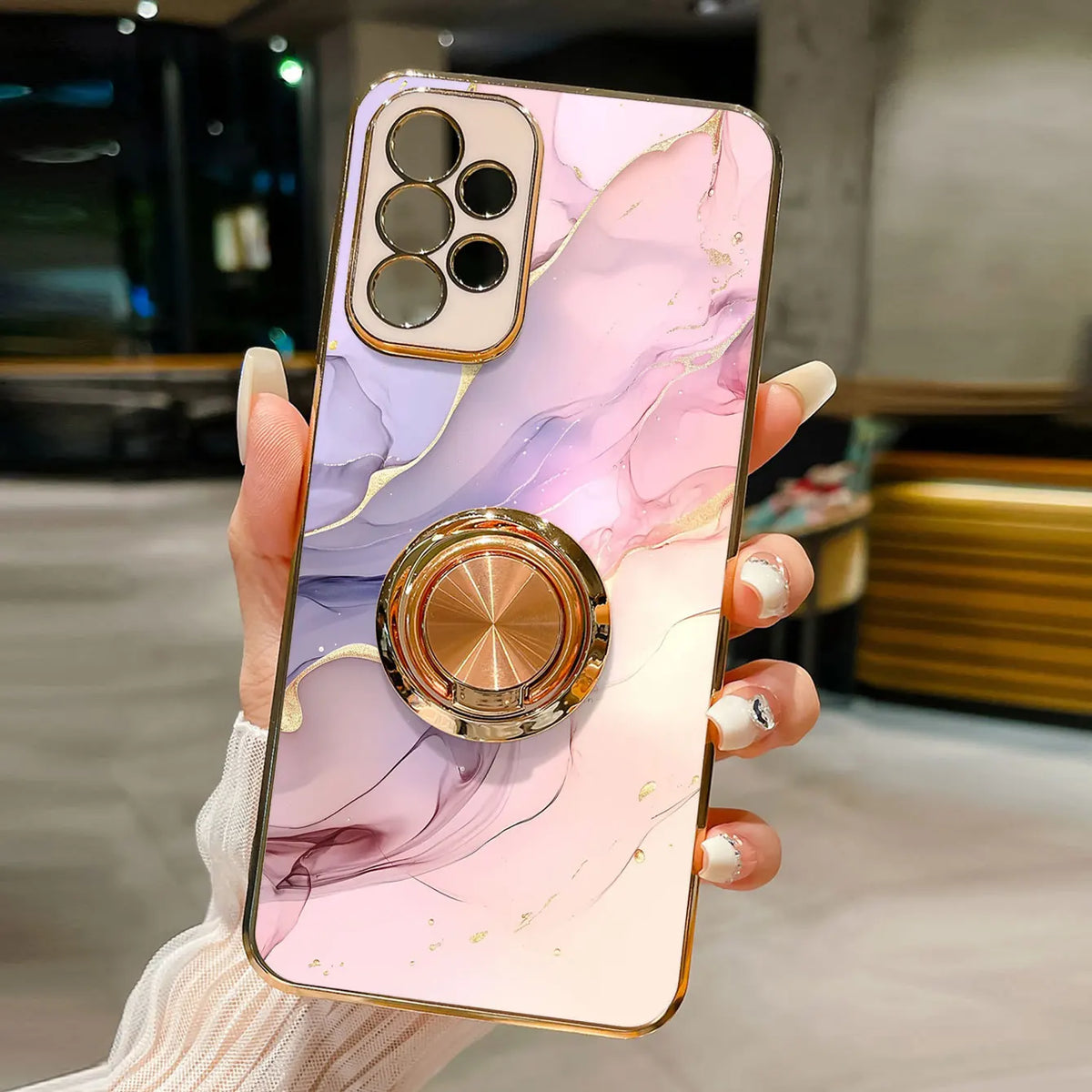 Phone case with ring stand featuring a marble pattern, designed by Corporación Turística, shown in the image.