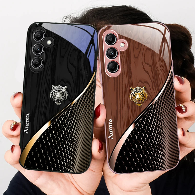 Glass phone case with a golden tiger design, featuring sleek transparent material and intricate tiger artwork.