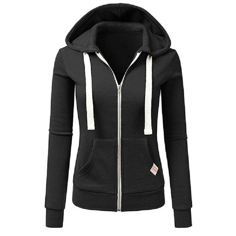 Personalized women's autumn/winter sports fashion coat by Corporación Turística, shown in a stylish outdoor setting.