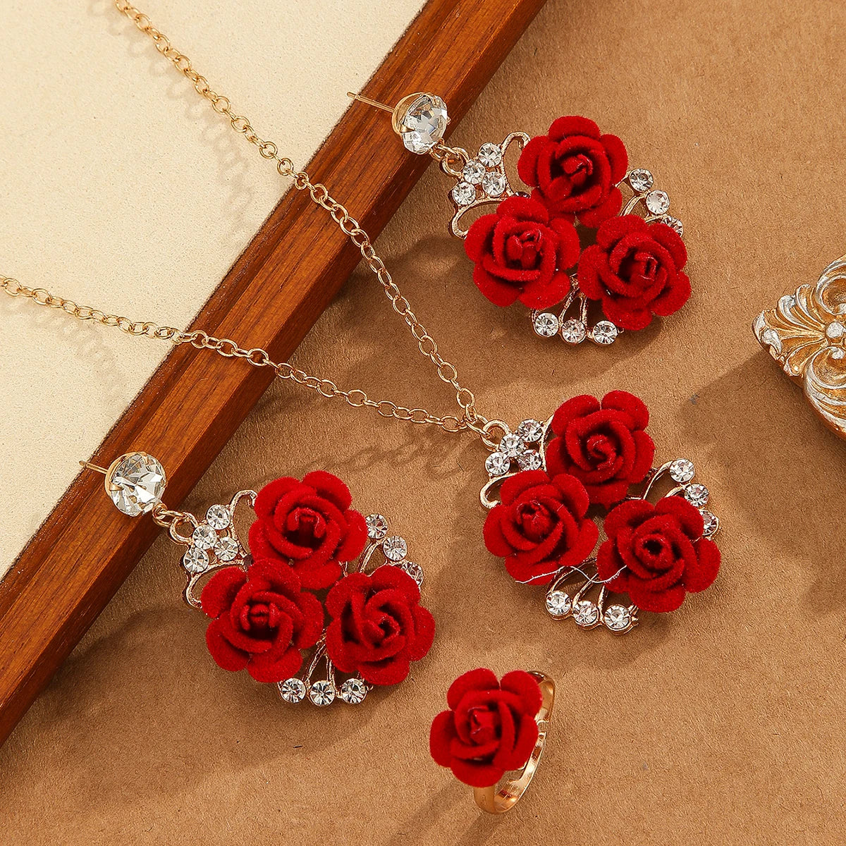 Set of 4 romantic red roses with intricate details, ideal for decorative or gifting purposes, by Corporación Turística.