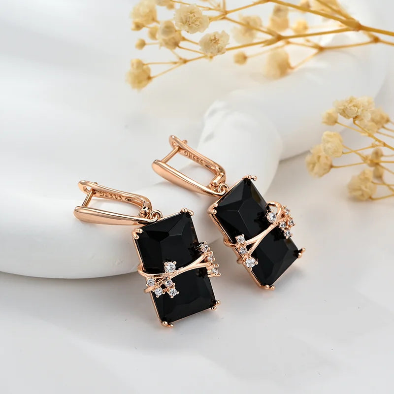 Black square stone dangle earrings from Corporación Turística, long and stylish jewelry for elegant occasions.