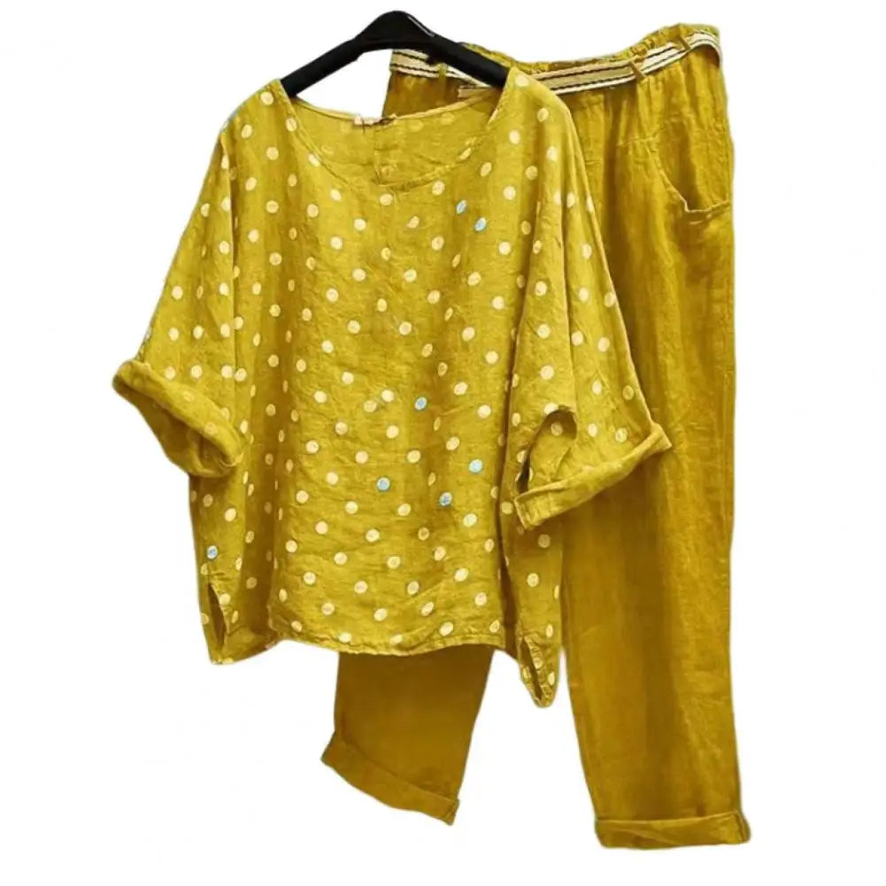 Spring and summer women's outfit featuring a blouse and pants from Corporación Turística, displayed in a stylish, casual setting.