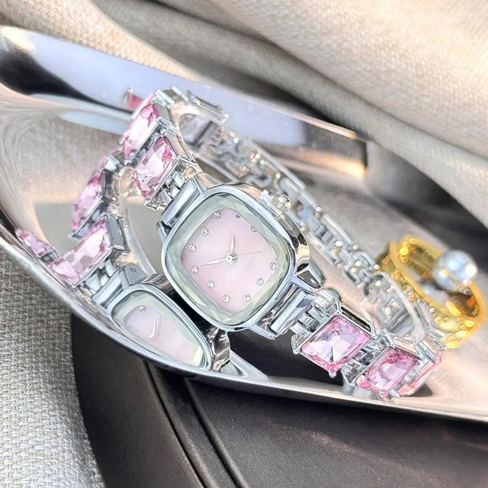 Brillante women's square-faced wristwatch by Corporación Turística with a sleek design and polished metal band.