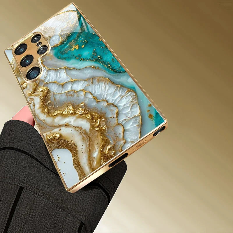 Metallic painted glass phone case for smartphones, featuring a vibrant, artistic design with a glossy finish.