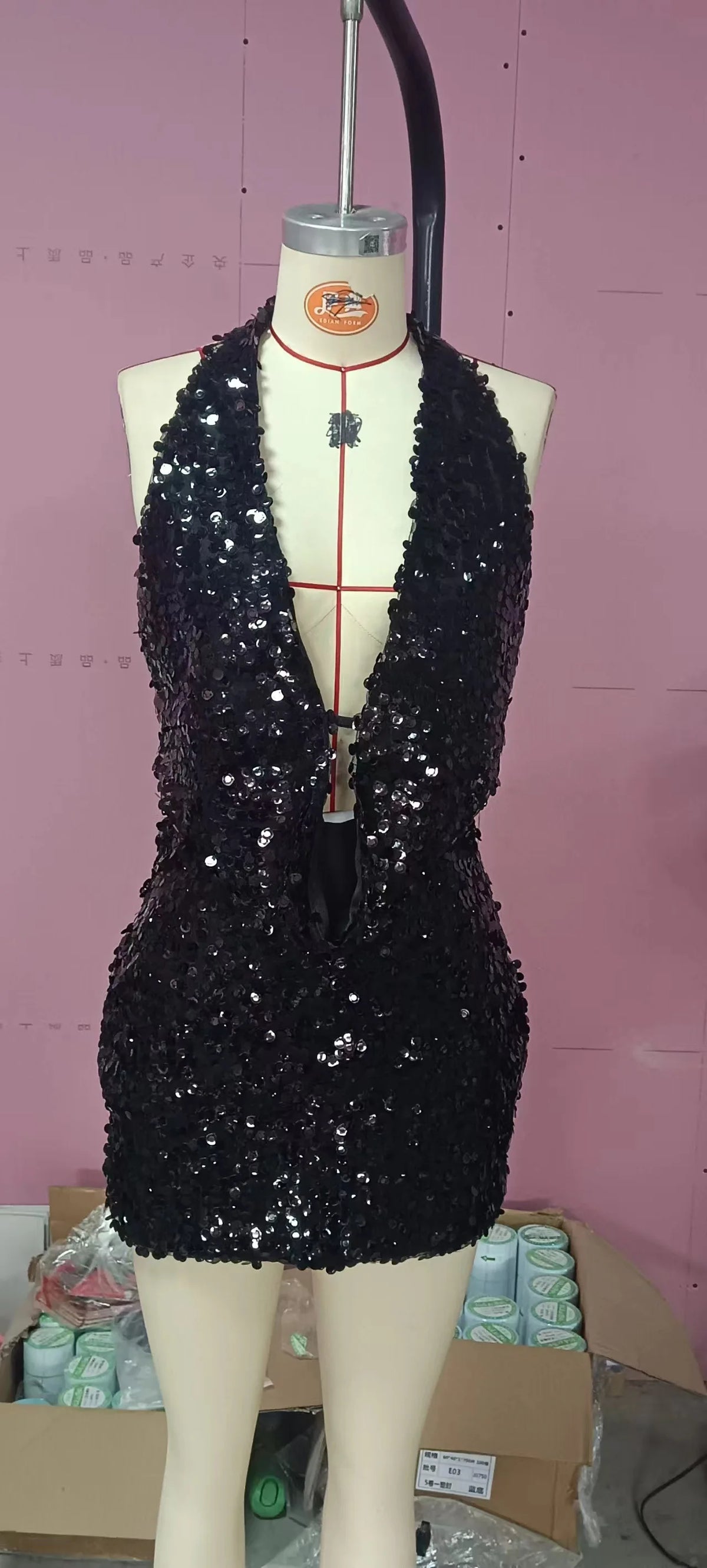 Two-piece sexy sequin crop top and skirt set from Corporación Turística, sleeveless top with shimmering embellishments.