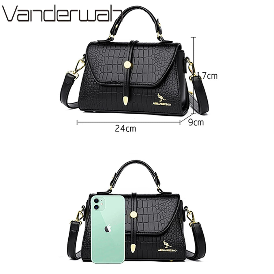 Crocodile leather crossbody bag by Corporación Turística 2024 with sleek design and textured finish.