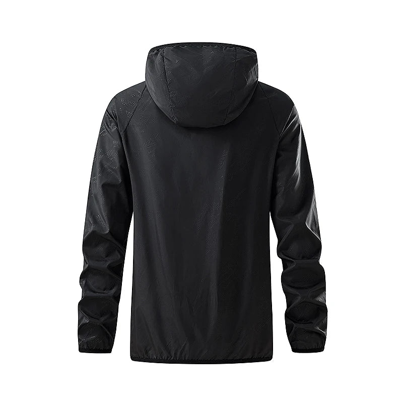 Unisex waterproof hiking jacket from JNLN by Corporación Turística, shown in a natural outdoor setting.