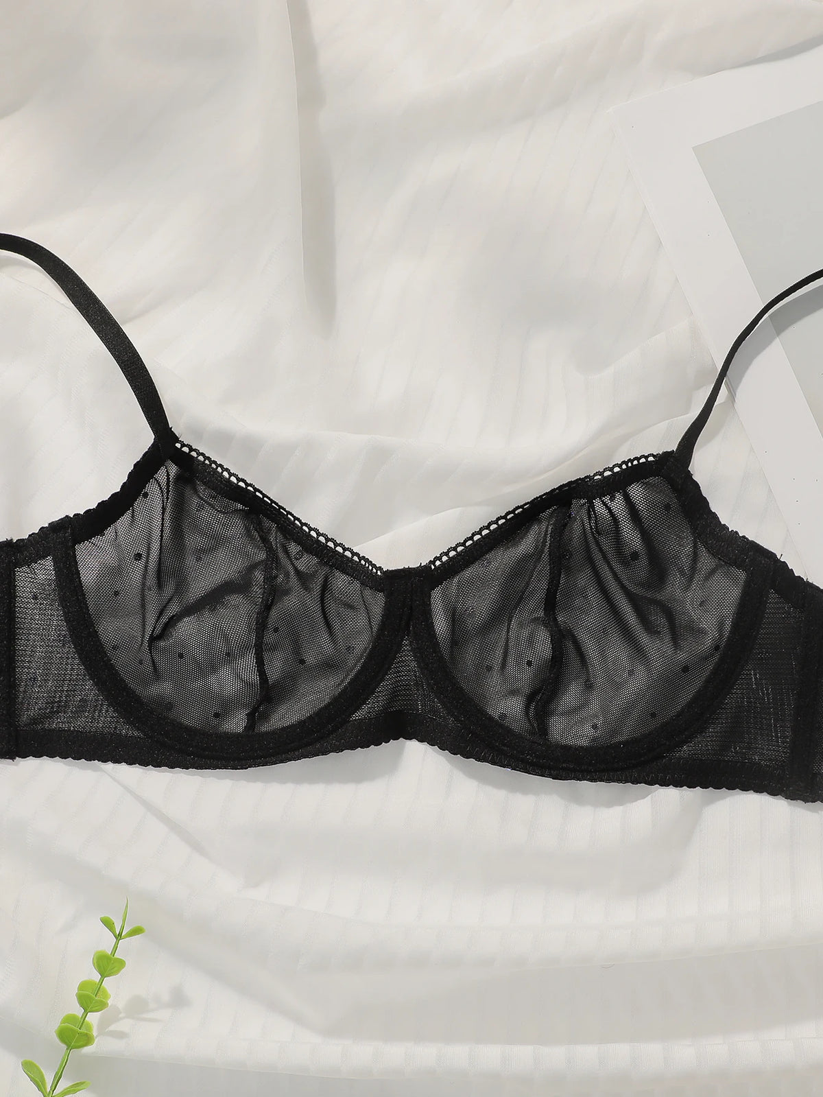 Sexy black lace and sequin lingerie set from Corporación Turística, featuring delicate lace and shimmering embellishments.