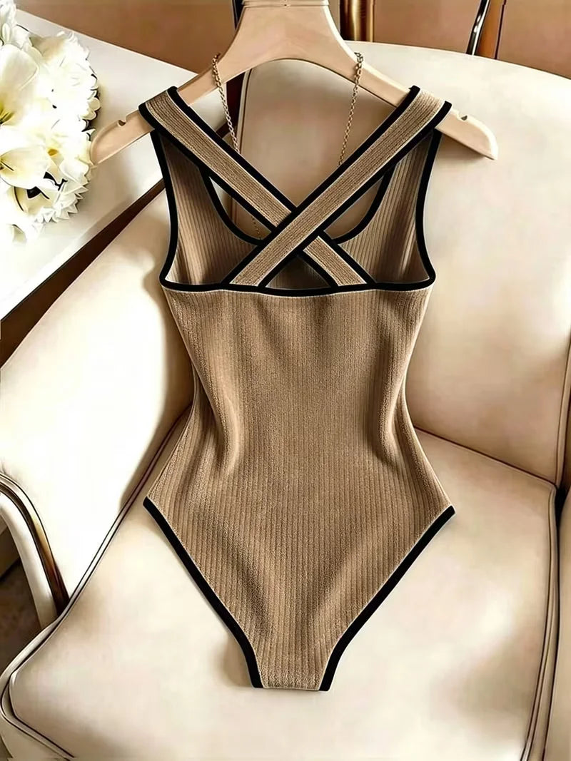 Cream-colored women's sleeveless ribbed knit body with open back, stylish and comfortable for casual wear.