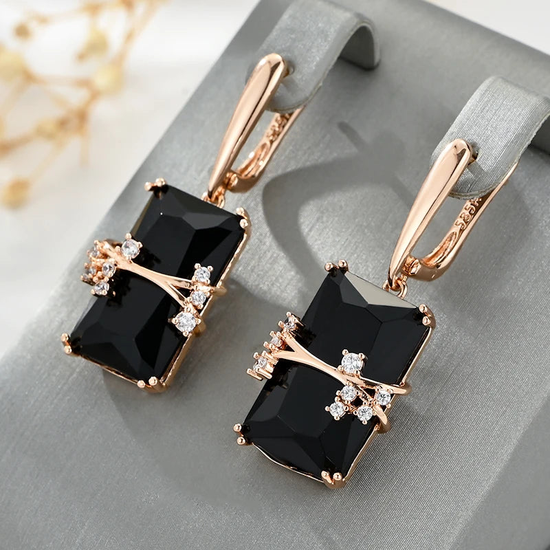 Black square stone dangle earrings from Corporación Turística showing long, elegant design with geometric stone accents.