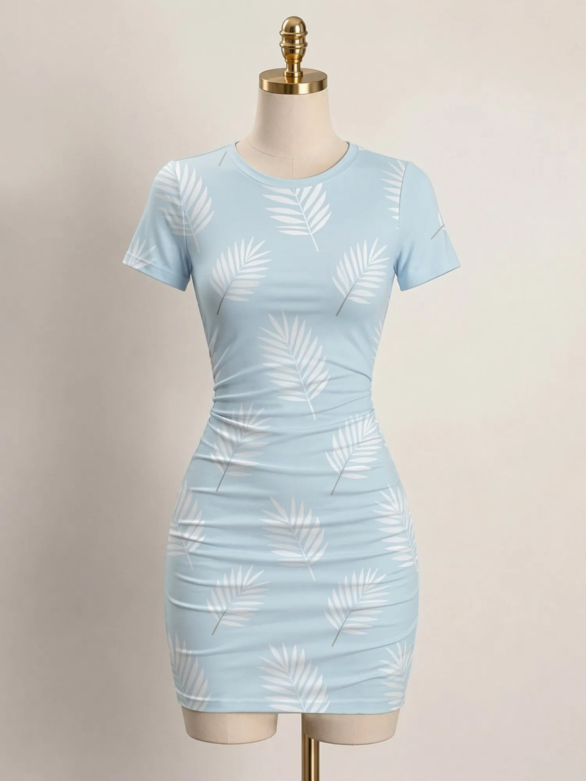 Close-up of a fitted women's mini dress with short sleeves and a high neckline, from Corporación Turística.