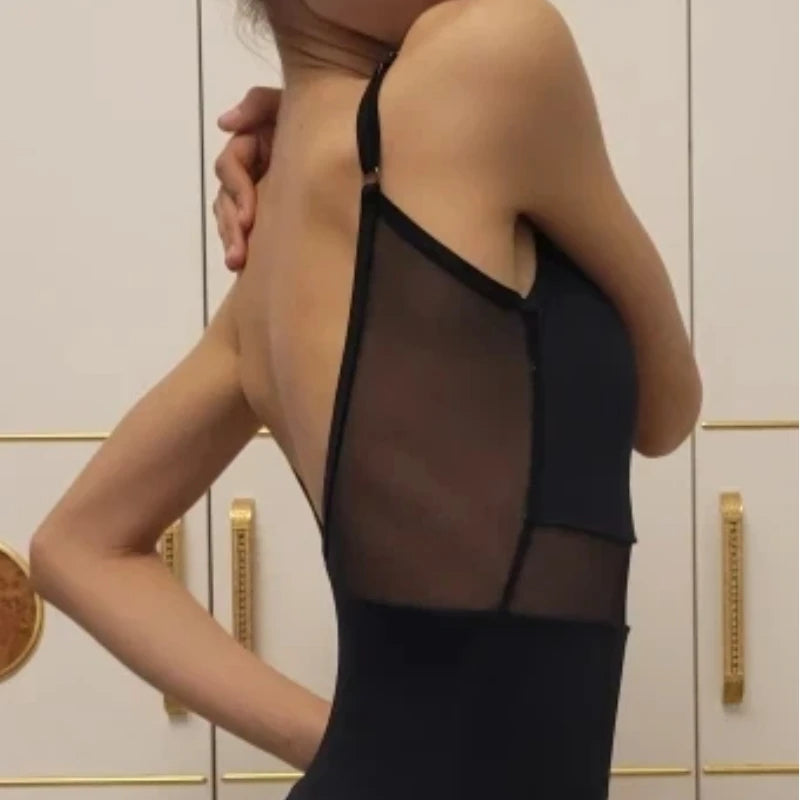 Female ballet and dance leotard by Corporación Turística, gymnastic costume in black with pink accents, suitable for dance practice.