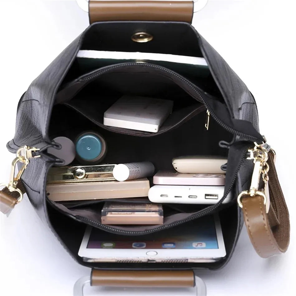 Genuine leather women's handbag by Corporación Turística, stylish leather hand bag with elegant design and sturdy handles.
