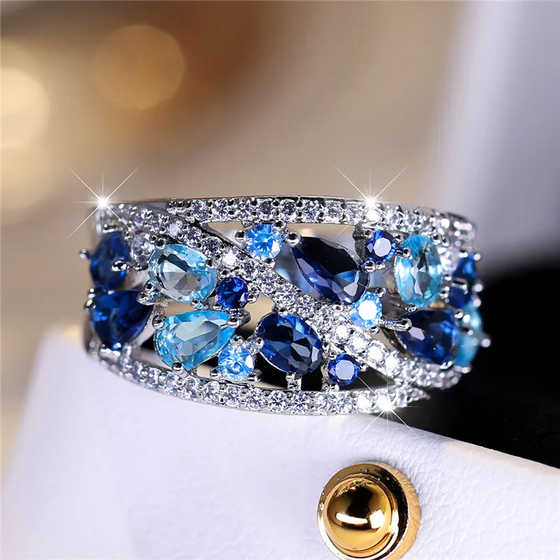 Blue cubic zirconia luxury women's ring featuring a sparkling blue gemstone and elegant silver band.
