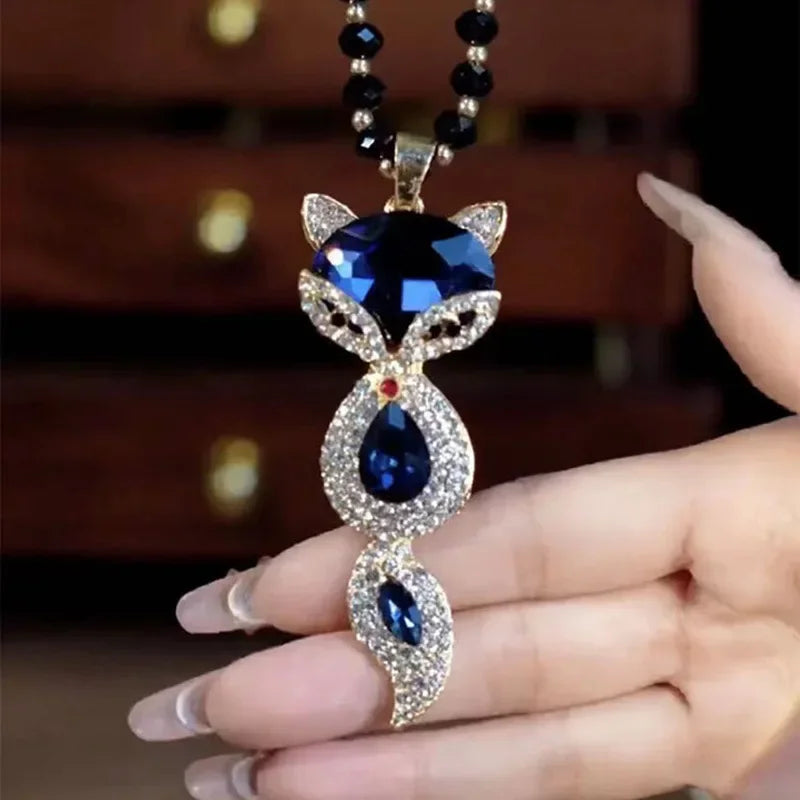 Luxury collar with fox pendant and large crystals, featuring elegant design and intricate detailing in a high-quality jewelry piece.