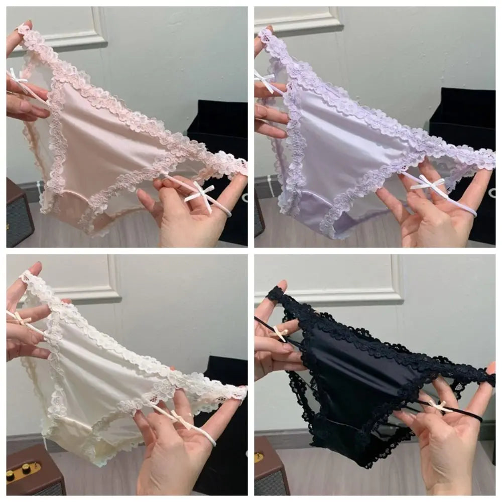 Elegant lace underwear by Corporación Turística featuring a delicate, sheer design with intricate cutout details.