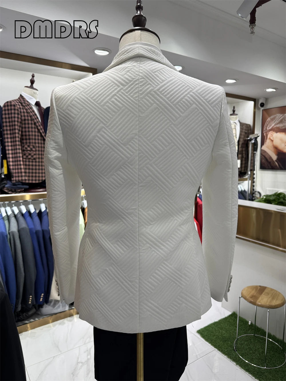 Elegant groom wedding suit by Corporación Turística, high-quality fabric, tailored fit, suitable for formal wedding ceremonies.