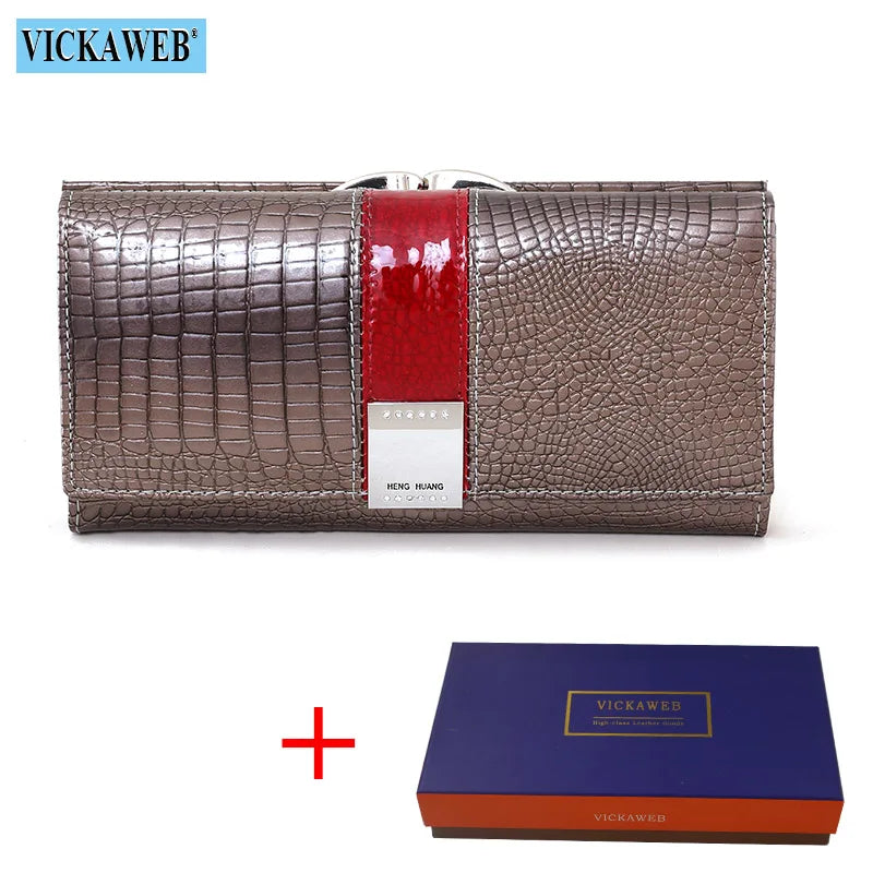 Long leather wallet from Corporación Turística, featuring a glossy patent finish and multiple card slots.