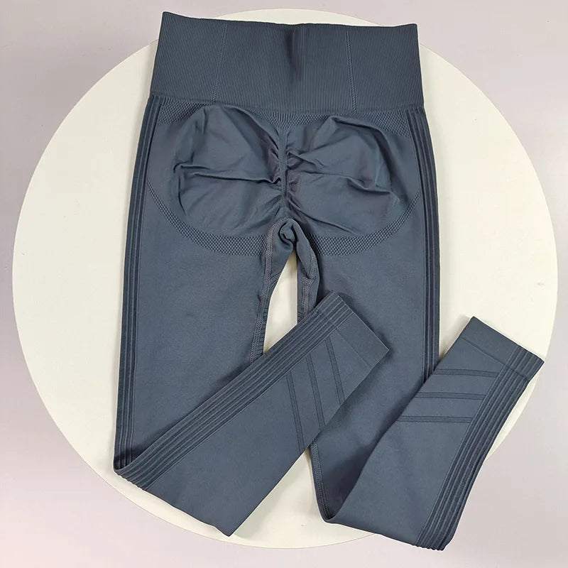 High-waisted women's yoga leggings in seamless fabric, black color, stretchy and comfortable for active wear.