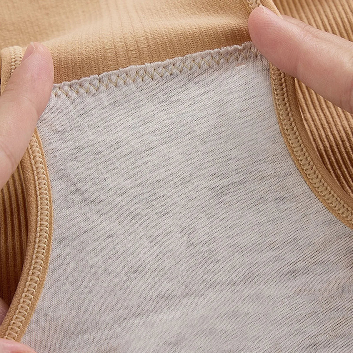 Postpartum belly control briefs for women, high-waisted shapewear by Corporación Turística, shown in beige fabric.