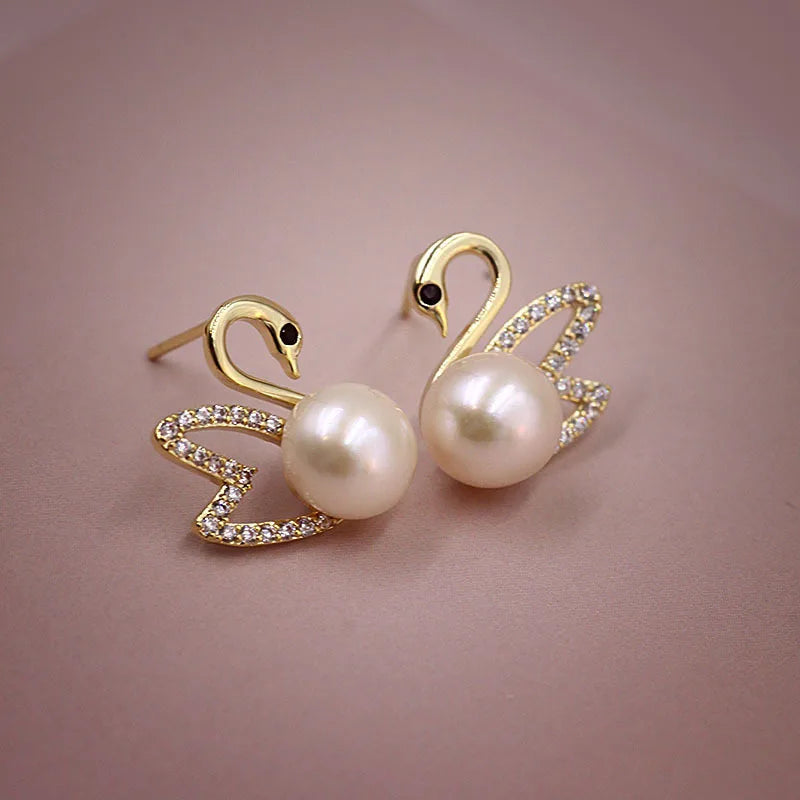 Pendientes de cisne de cristal hueco de aguja de plata 92...