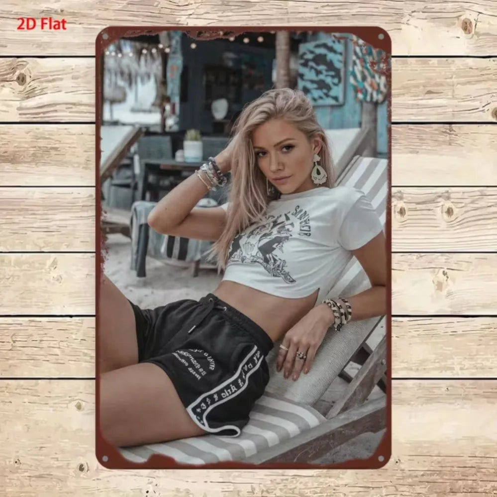Metallic 2D sign featuring a stylish woman design, ideal for branding or decorative use by Corporación Turística.
