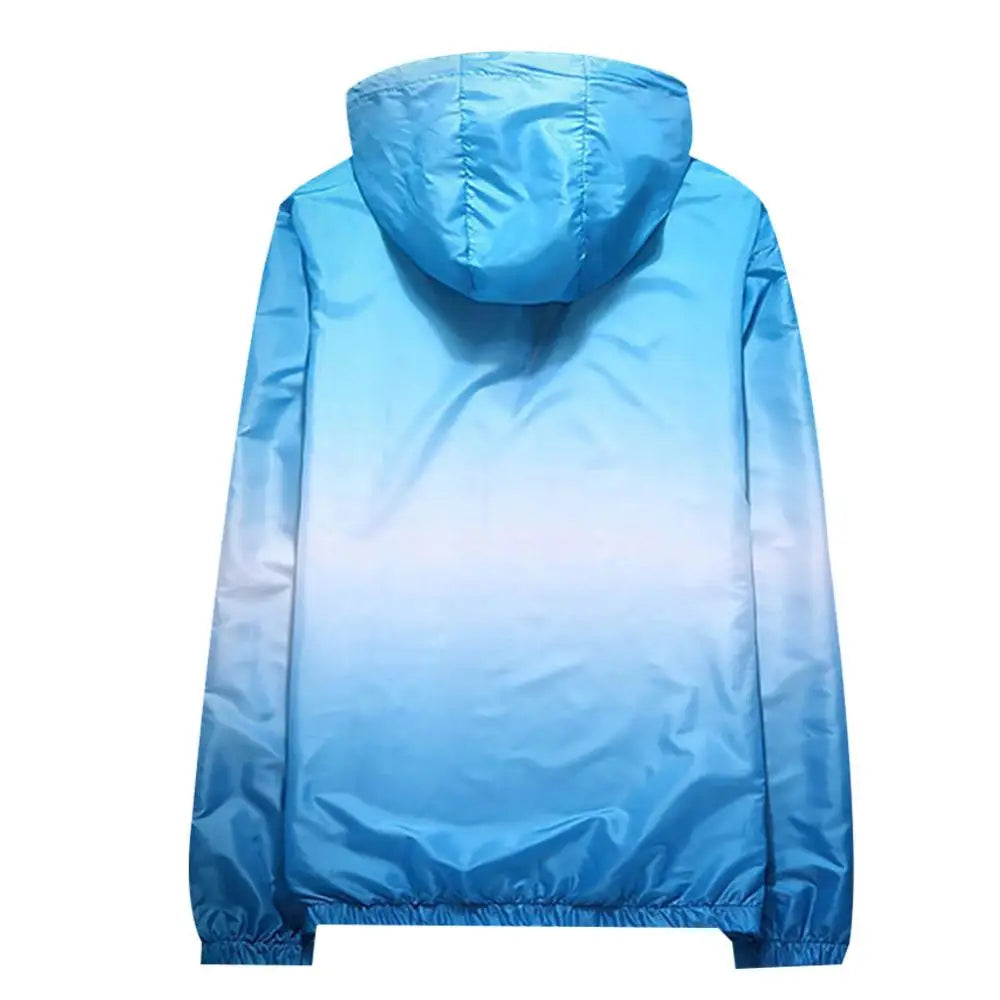Unisex solar protection jacket with storage pocket, lightweight outdoor clothing by Corporación Turística, shown in a neutral outdoor setting.