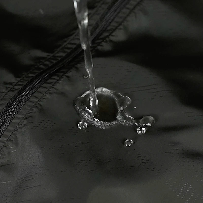 Unisex waterproof hiking jacket from JNLN by Corporación Turística, shown in a durable outdoor fabric with a hood and front zipper.