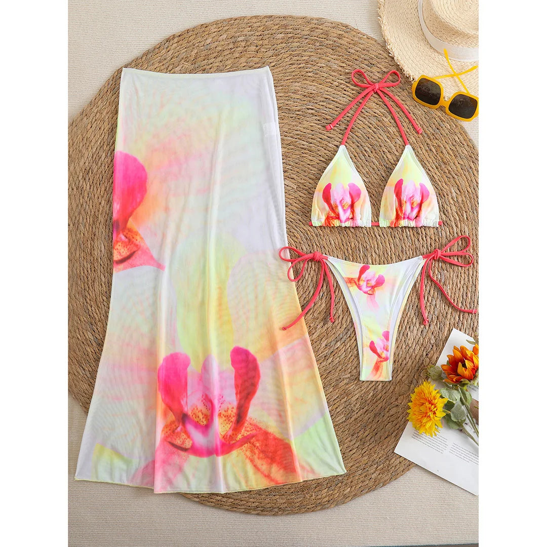 Colorful floral bikini with matching skirt, women's swimwear by Corporación Turística, featuring vibrant flower print and comfortable fit.