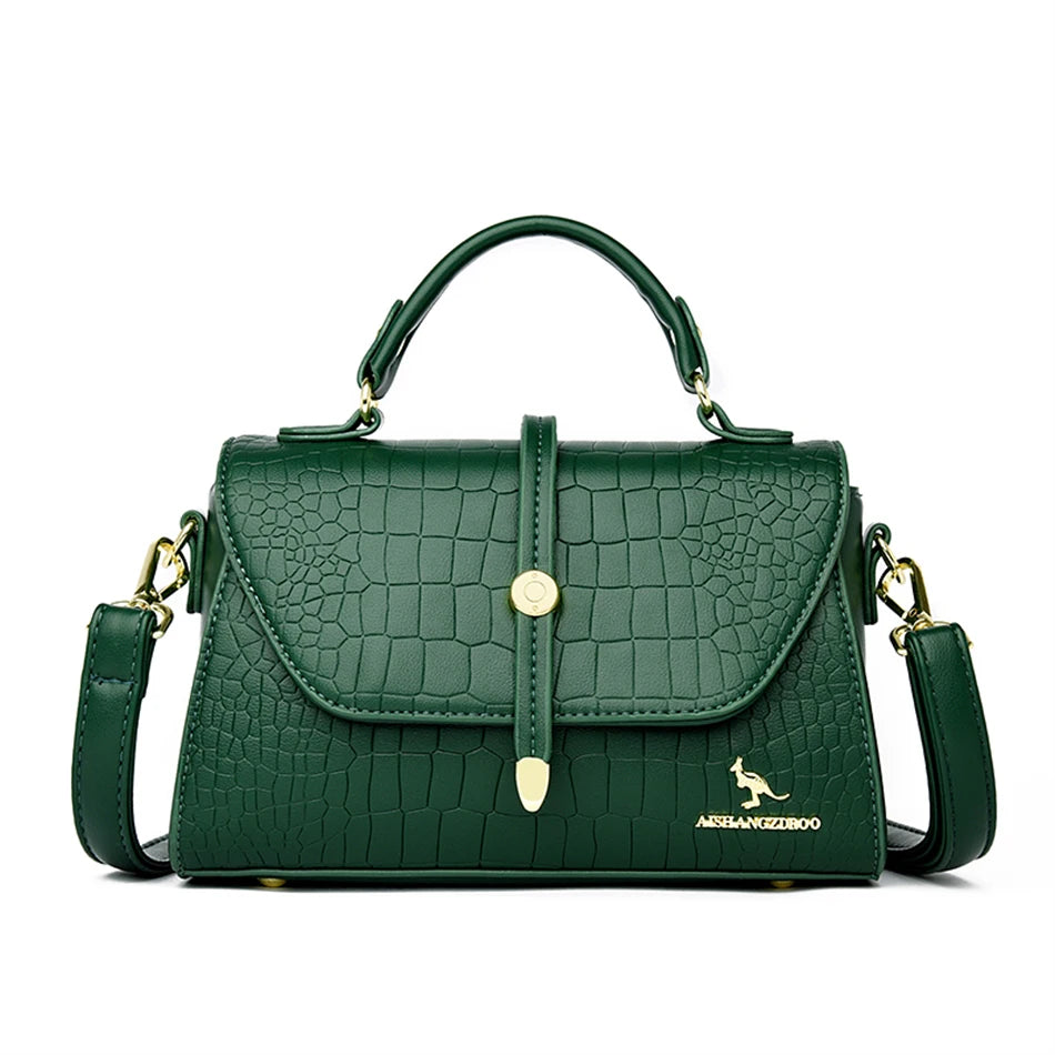 Crocodile leather crossbody bag from 2024 collection by Corporación Turística, featuring a sleek design and adjustable strap.